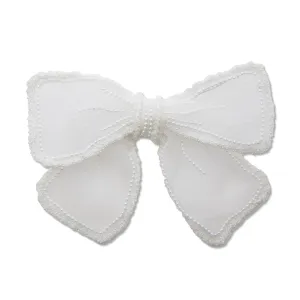 PORCELIN MARY PEARL EMBELLISHED BOW BARRETTE