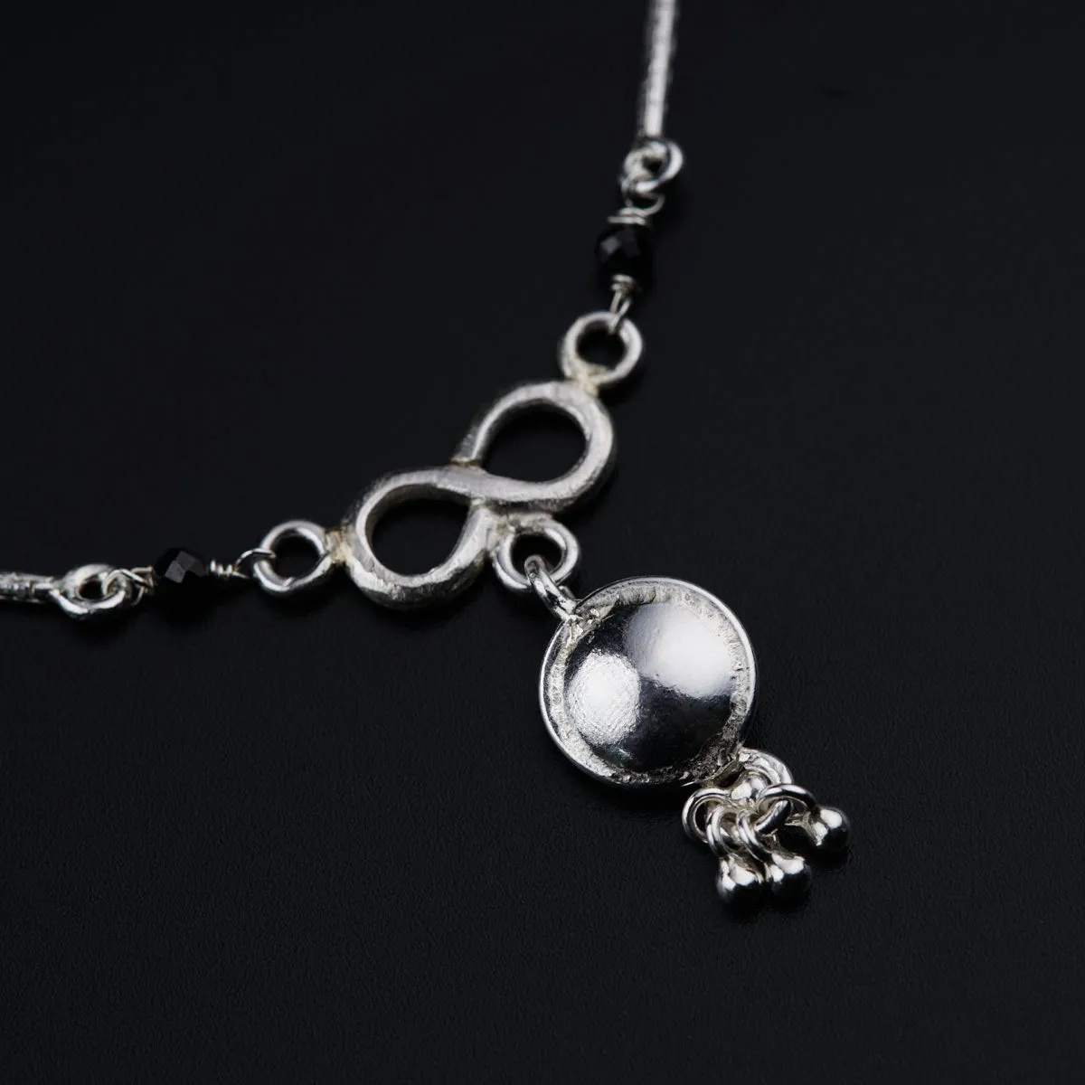 Silver mangalsutra with kudi and infinity motif